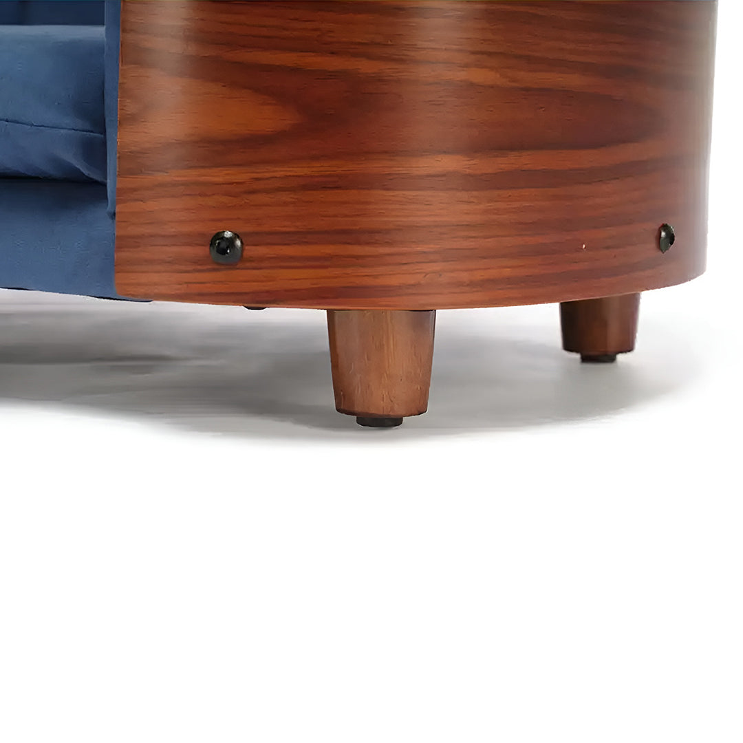 Scandinavian style elevated pet sofa bed designed for dogs, featuring a cushioned sleeping surface with wraparound supportive side panels and a raised base for stable and comfortable resting