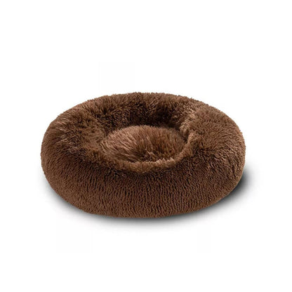 Round plush pet bed designed for small dogs, featuring a deep cushioned sleeping area with raised edges that provide comfort, support, and a secure resting space