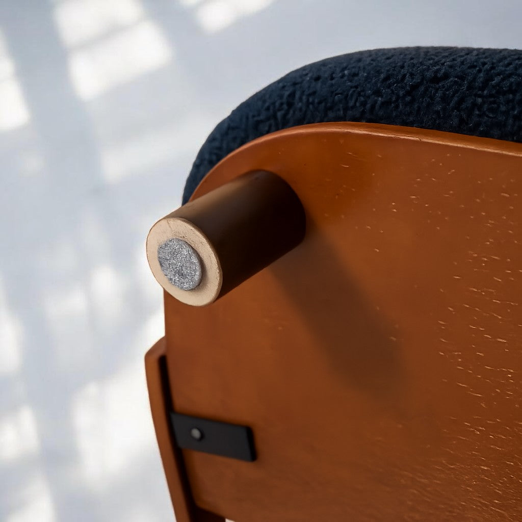 Scandinavian style elevated pet sofa bed designed for dogs, featuring a cushioned sleeping surface with a curved wooden backrest and raised legs for comfortable lounging and rest