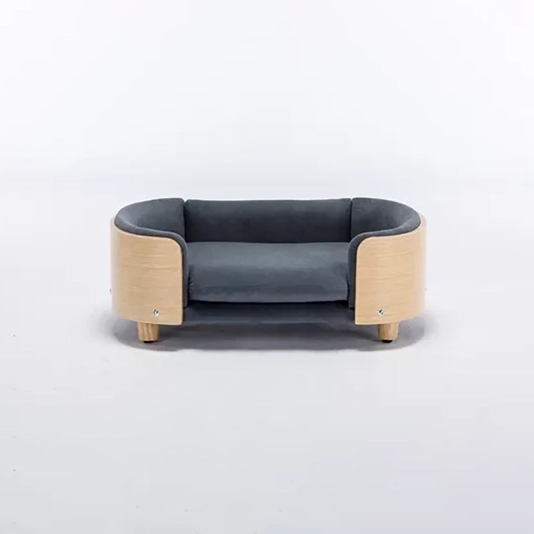 Scandinavian style elevated pet sofa bed designed for dogs, featuring a cushioned sleeping surface with curved supportive sides and raised legs for comfortable lounging and rest