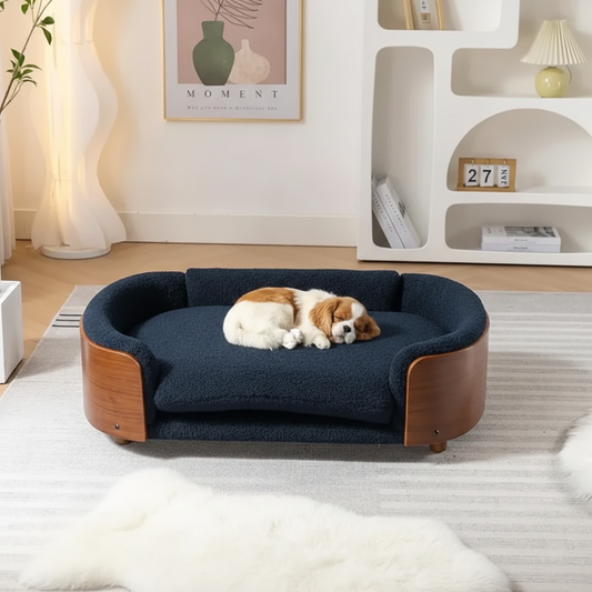 Scandinavian style elevated pet sofa bed designed for dogs, shown in a modern living space with a cushioned sleeping surface and curved supportive sides creating a comfortable lounging area