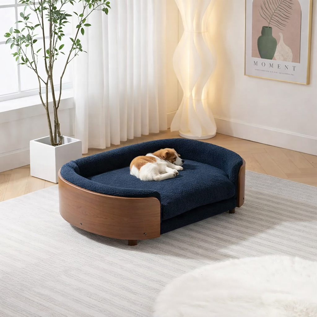 Scandinavian style elevated pet sofa bed designed for dogs, shown in a modern living space with a cushioned sleeping surface and curved supportive sides creating a comfortable lounging area