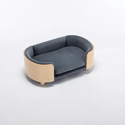 Scandinavian style elevated pet sofa bed designed for dogs, featuring a cushioned sleeping surface with curved supportive sides and raised legs for comfortable lounging and rest