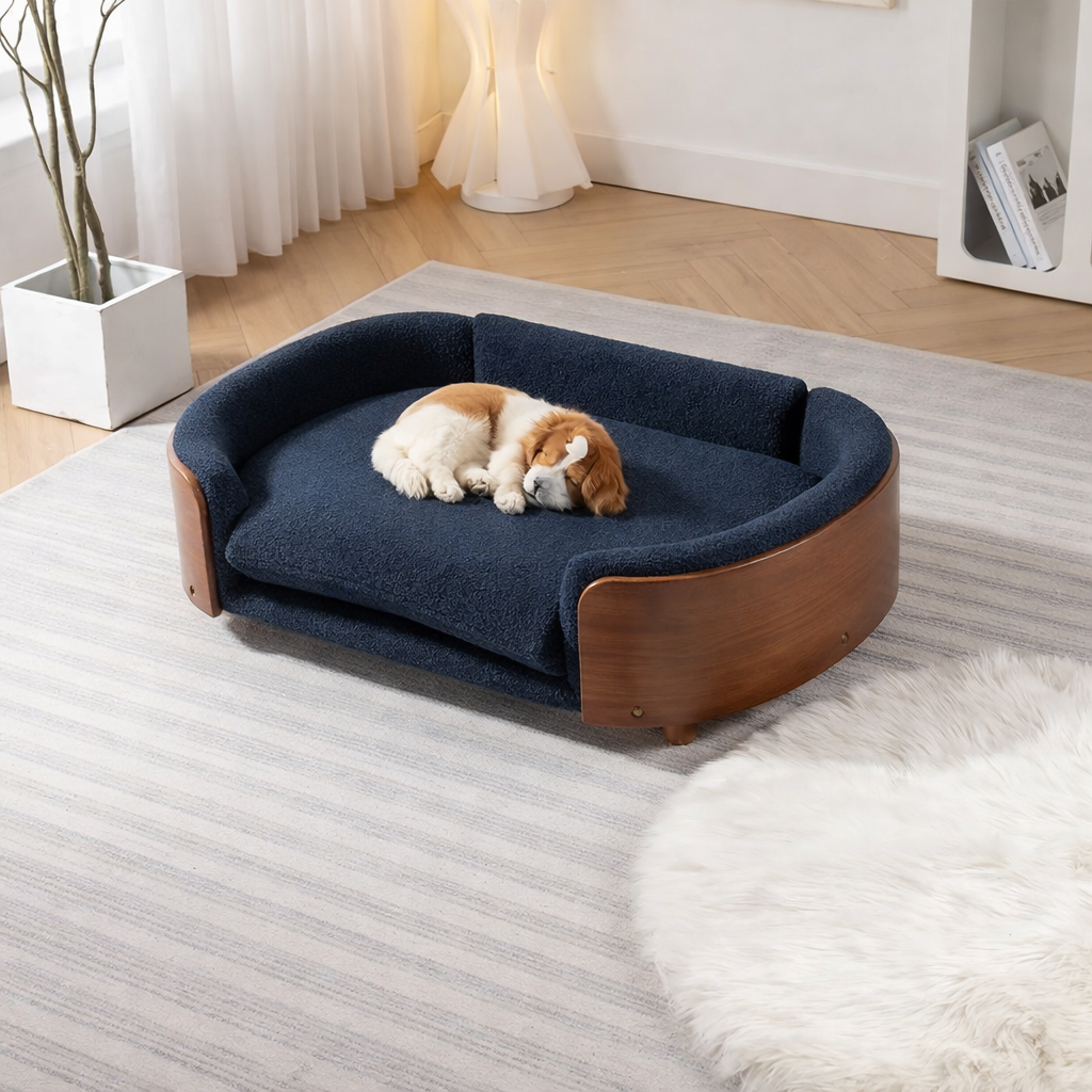 Scandinavian style elevated pet sofa bed designed for dogs, shown in a modern living space with a cushioned sleeping surface and curved supportive sides creating a comfortable lounging area