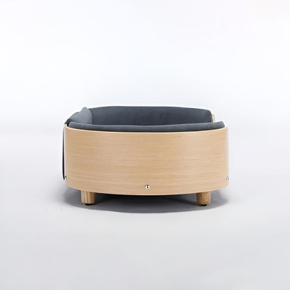 Scandinavian style elevated pet sofa bed designed for dogs, featuring a cushioned sleeping surface with curved supportive sides and raised legs for comfortable lounging and rest