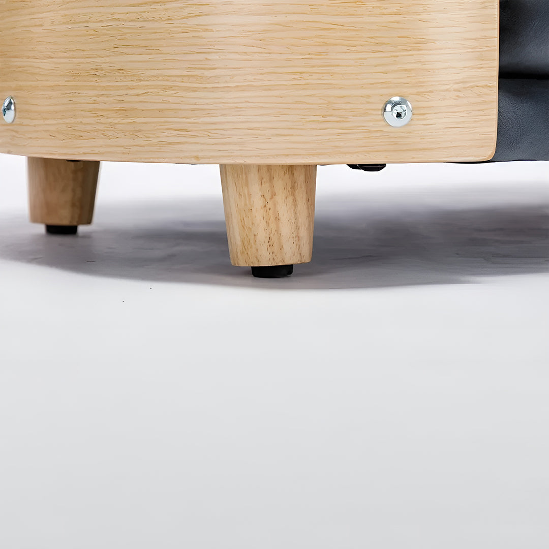 Scandinavian style elevated pet sofa bed designed for dogs, featuring a cushioned sleeping surface with curved supportive sides and raised legs for comfortable lounging and rest