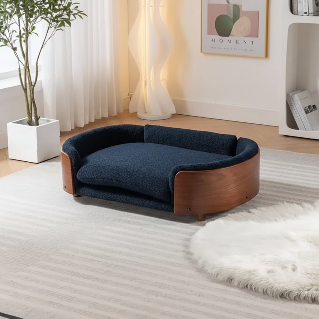 Scandinavian style elevated pet sofa bed designed for dogs, shown in a modern living space with a cushioned sleeping surface and curved supportive sides creating a comfortable lounging area