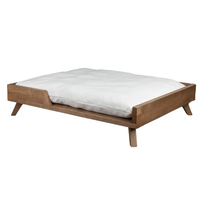 Scandinavian style elevated pet sofa bed designed for dogs, featuring a thick cushioned sleeping surface with an open front entry, sturdy wooden frame, and raised legs for supportive and comfortable resting