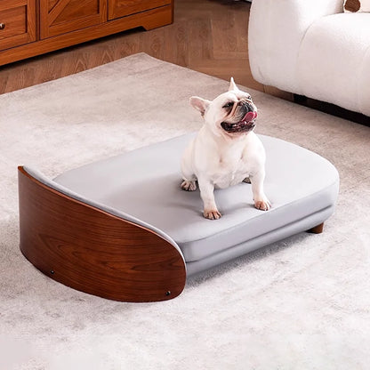 Scandinavian style elevated pet sofa bed designed for dogs, featuring a cushioned sleeping surface with a curved wooden side panel and raised base for supportive and comfortable resting
