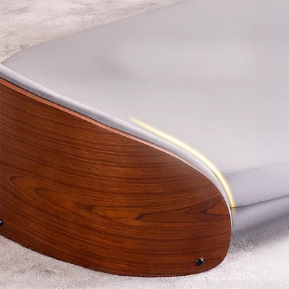 Scandinavian style elevated pet sofa bed designed for dogs, featuring a cushioned sleeping surface with a curved wooden side panel and raised base for supportive and comfortable resting