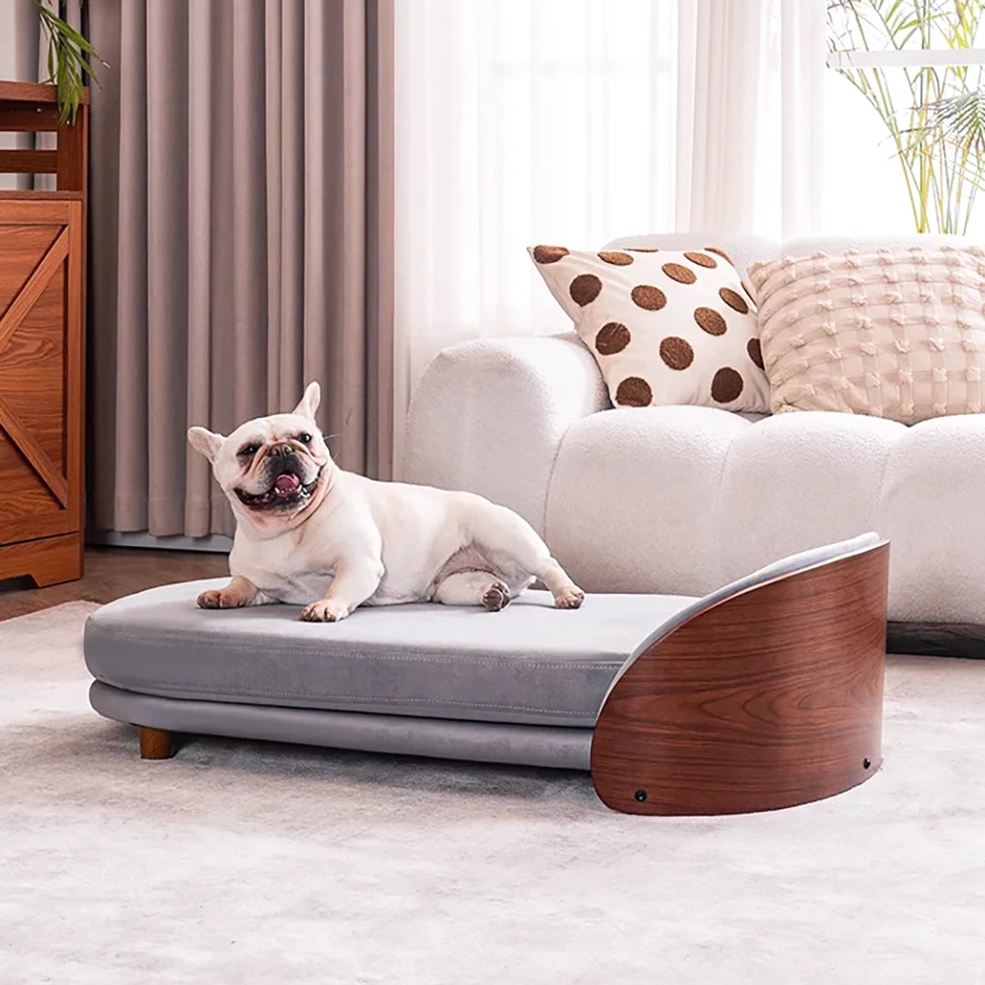 Scandinavian style elevated pet sofa bed designed for dogs, featuring a cushioned sleeping surface with a curved wooden side panel and raised base for supportive and comfortable resting
