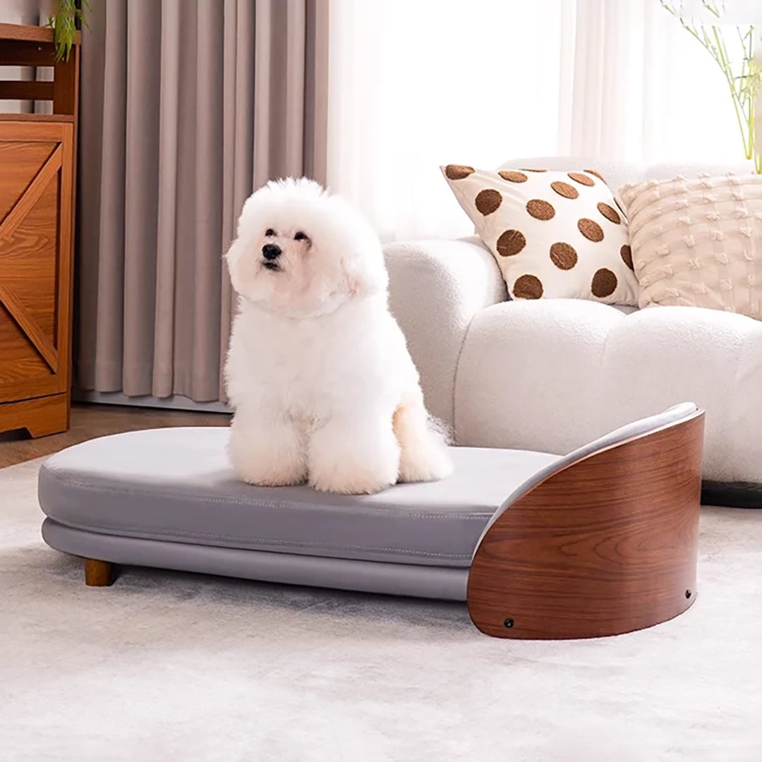 Scandinavian style elevated pet sofa bed designed for dogs, featuring a cushioned sleeping surface with a curved wooden side panel and raised base for supportive and comfortable resting