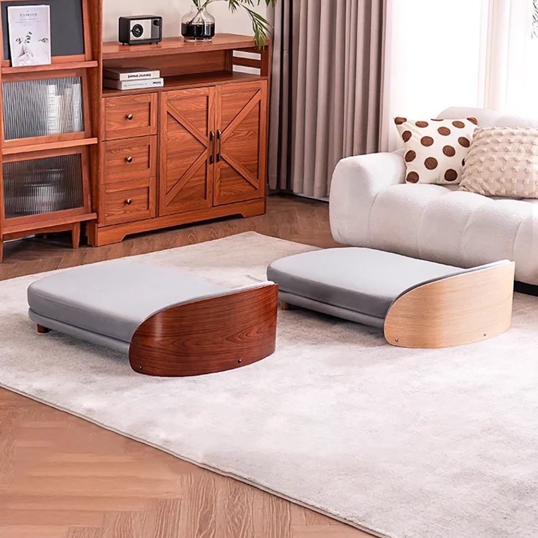 Scandinavian style elevated pet sofa bed designed for dogs, featuring a cushioned sleeping surface with a curved wooden side panel and raised base for supportive and comfortable resting