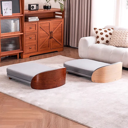 Scandinavian style elevated pet sofa bed designed for dogs, featuring a cushioned sleeping surface with a curved wooden side panel and raised base for supportive and comfortable resting