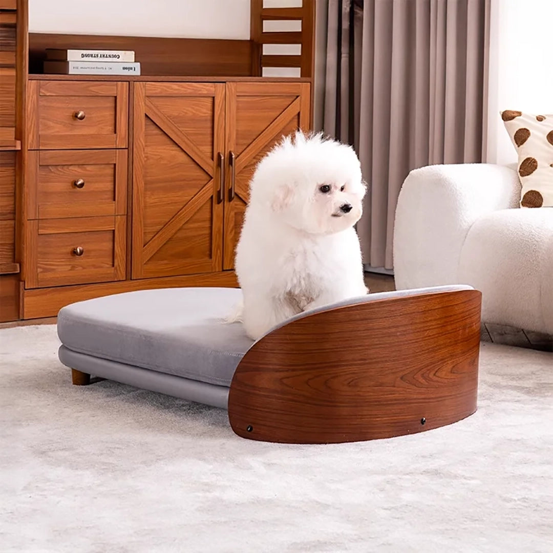 Scandinavian style elevated pet sofa bed designed for dogs, featuring a cushioned sleeping surface with a curved wooden side panel and raised base for supportive and comfortable resting