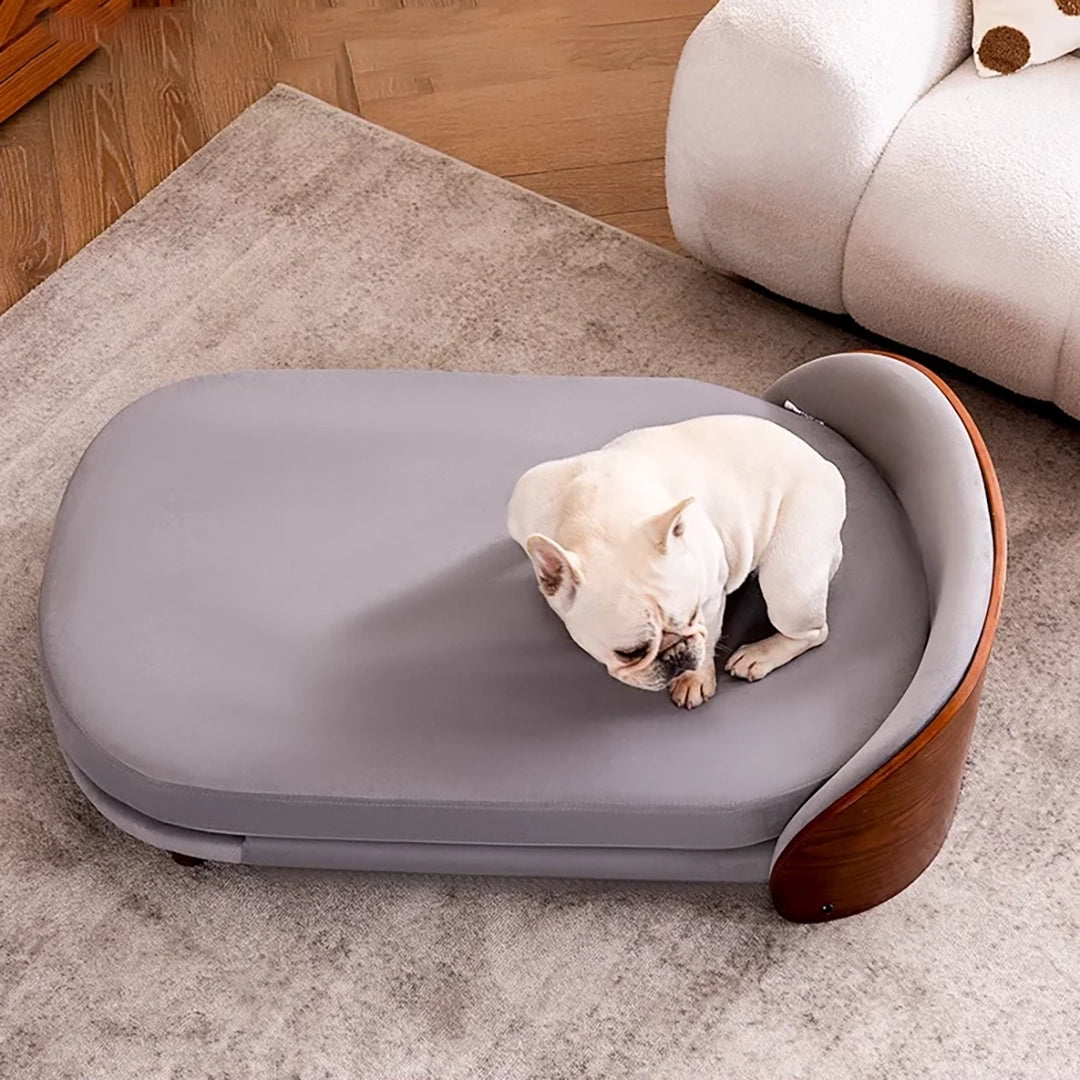Scandinavian style elevated pet sofa bed designed for dogs, featuring a cushioned sleeping surface with a curved wooden side panel and raised base for supportive and comfortable resting